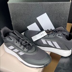 Men’s Adidas size 10 1/2 basketball sneakers, black and white color new in box